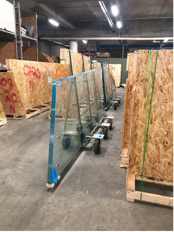 Transporting heavy glass elements on the Montreal Tower with Heavydrive HDL glass trolleys.